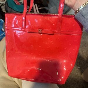 Like new Kate Spaid red shiny bag, never used robe